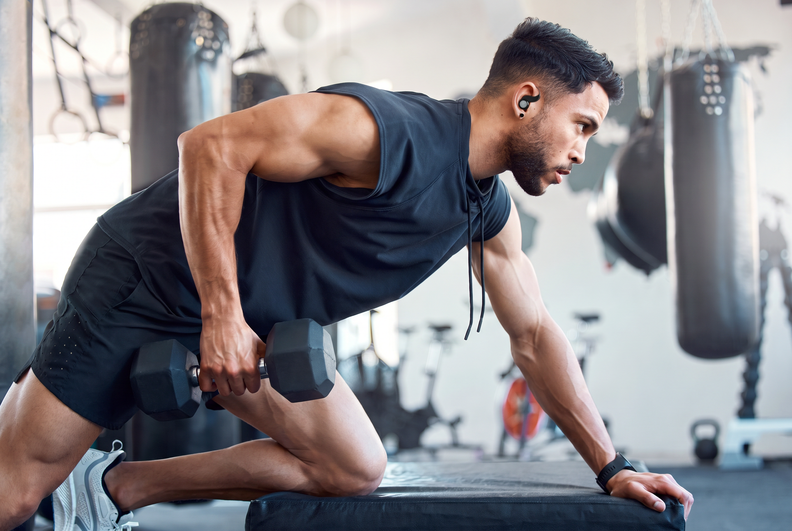 Guy Working Out Wearing Cricket Secure Fit Wireless Earbuds